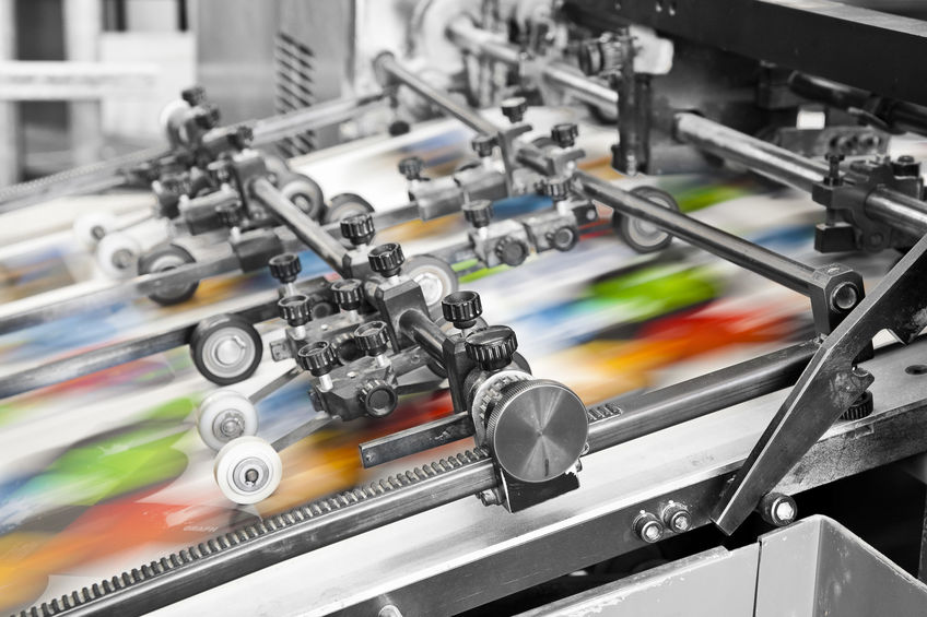 Close up of an offset printing machine during production